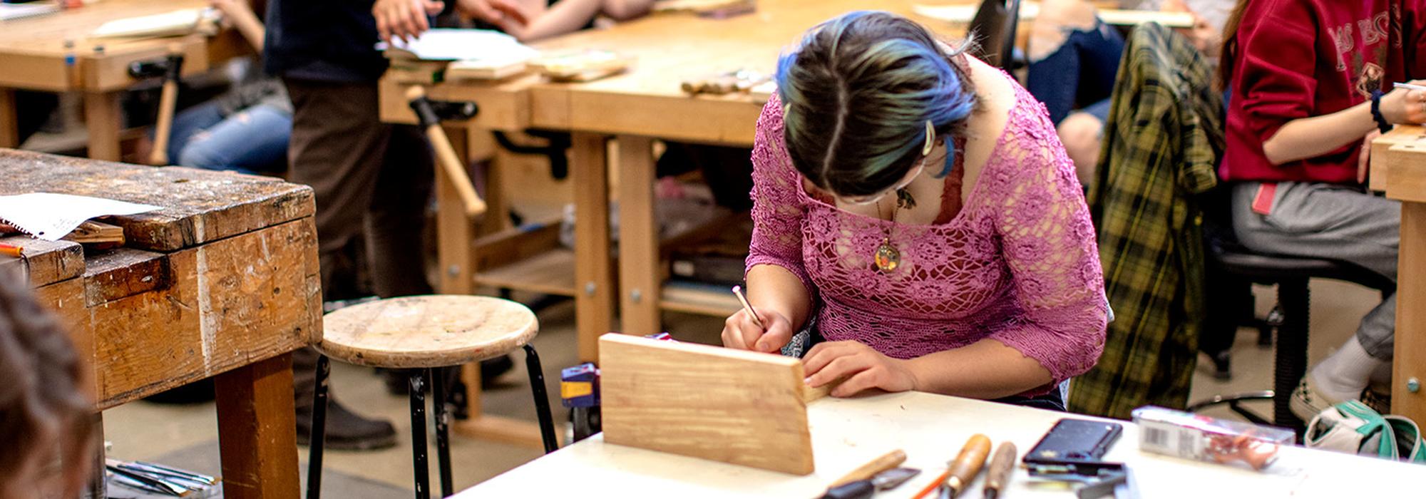 studio art class works on relief-carving wood